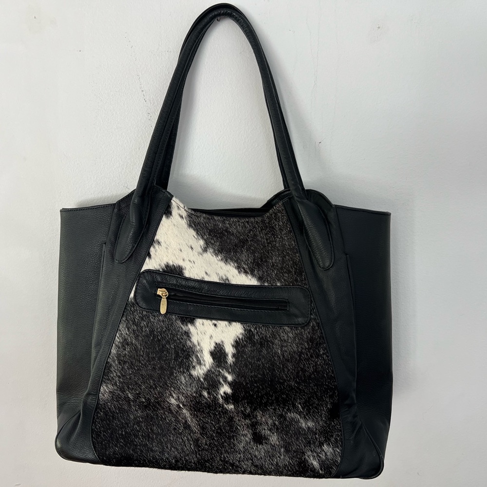 Handmade Cow Hide Leather shoulder bag.